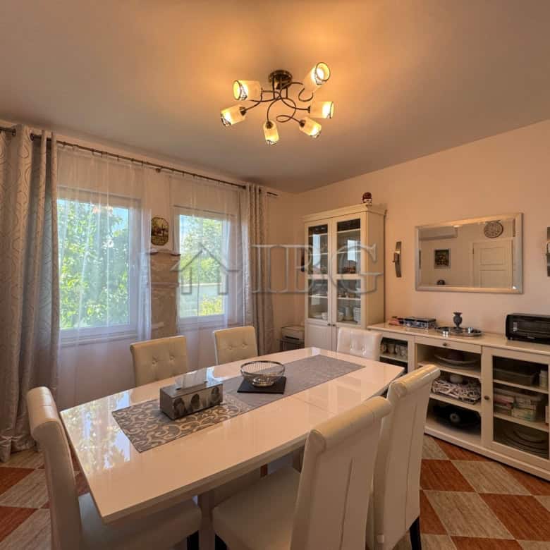 Bright interior of a spacious dining area in a two-storey house near Kosharitsa, 6 km from the sea.