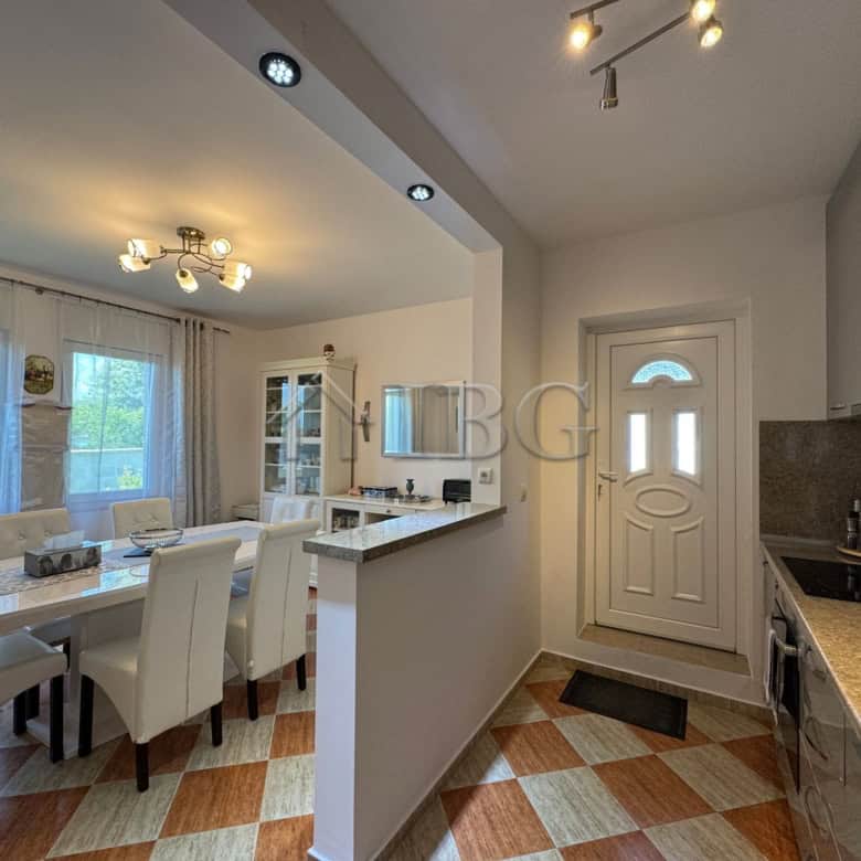 Spacious two-storey house interior with a bright dining area and modern kitchen in Kosharitsa, just.