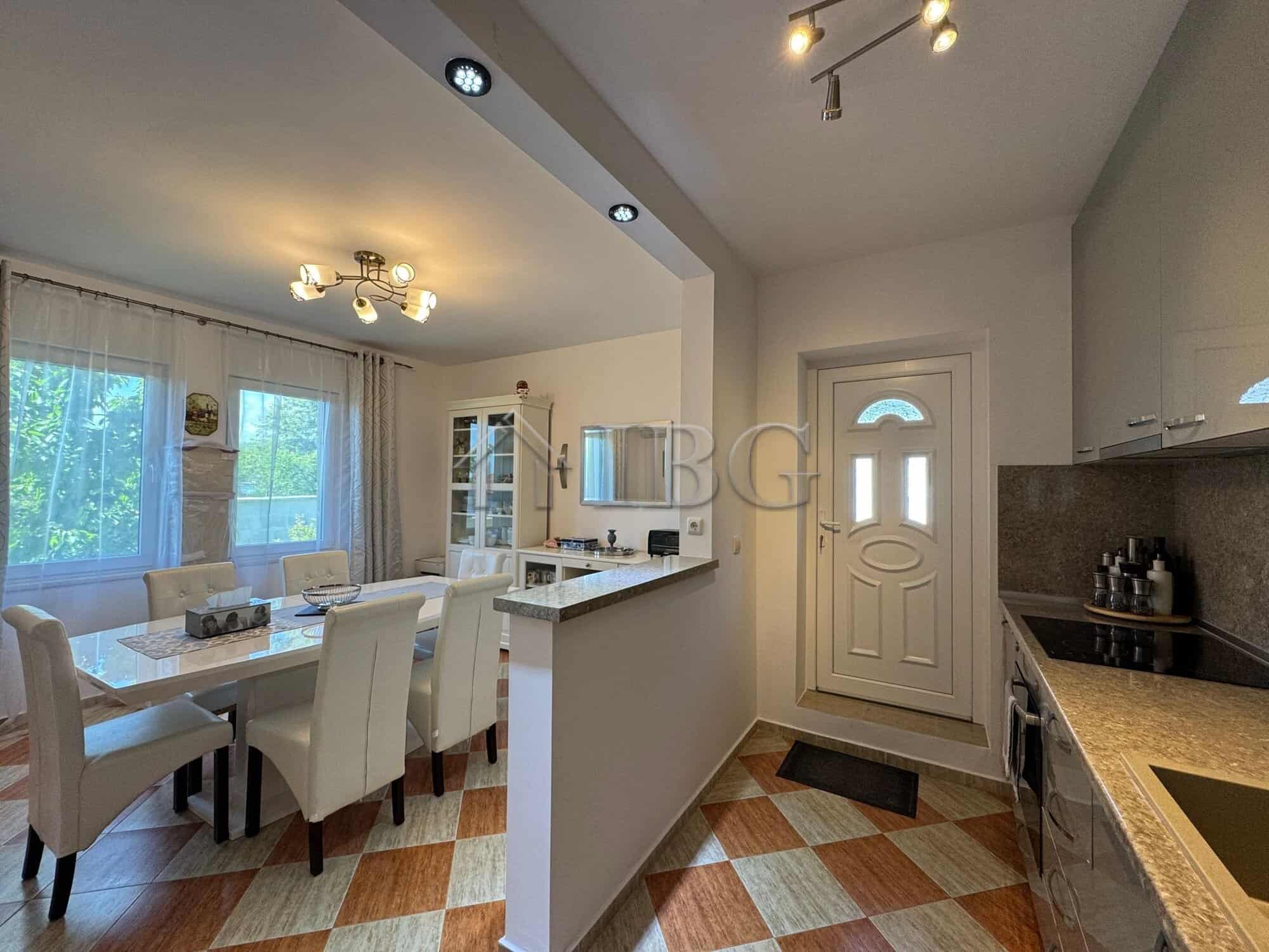 Spacious two-storey house interior with a bright dining area and modern kitchen in Kosharitsa, just.