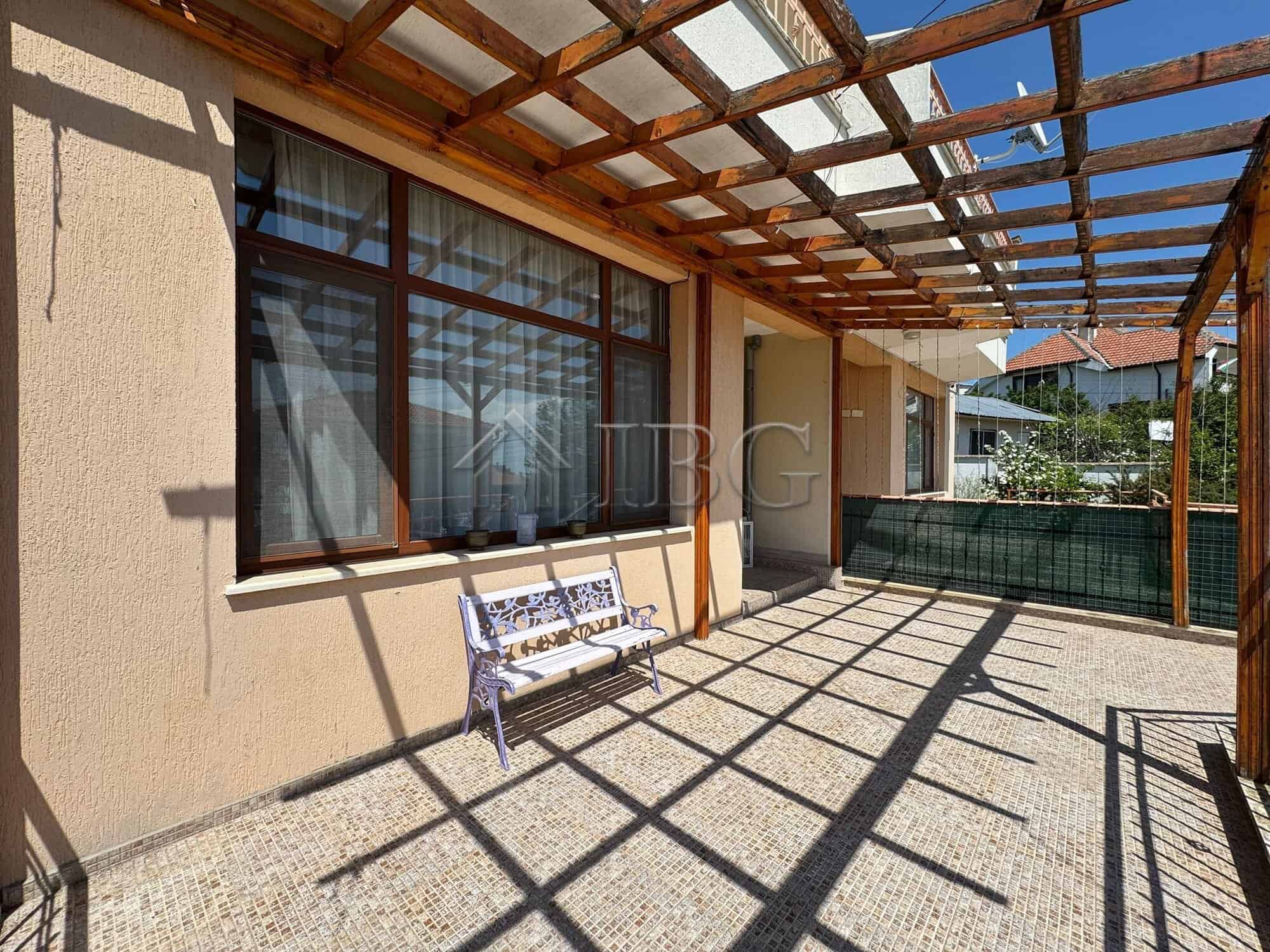 Outdoor terrace of a two-storey house in Kosharitsa, 6 km from the sea. Bright, open space with wood.