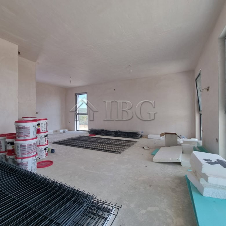 Modern house under construction with large windows and sea view in Banya Village.