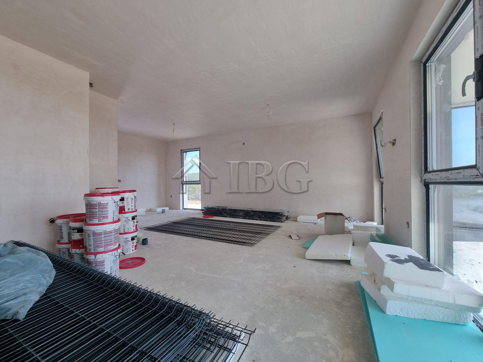 Modern house under construction with large windows and sea view in Banya Village.