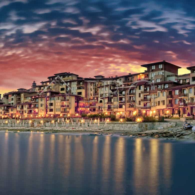 Modern seaside apartments in Sveti Vlas with scenic park views at sunset.