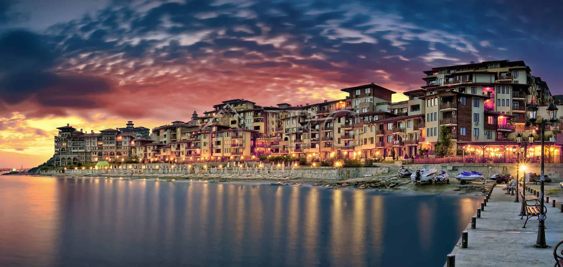 Modern seaside apartments in Sveti Vlas with scenic park views at sunset.