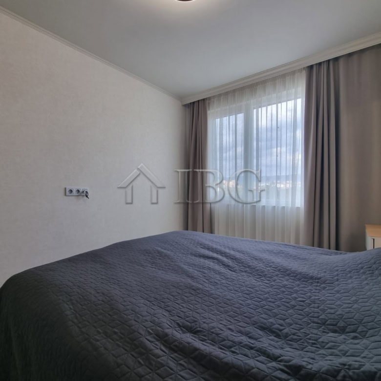 Modern 1-bedroom apartment with large window and natural light in Sunny Beach.