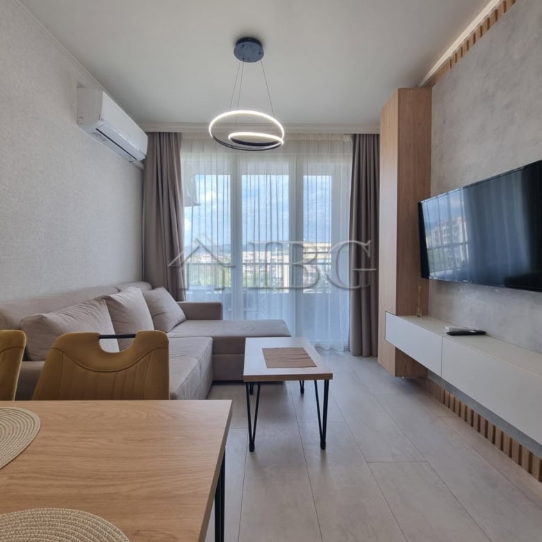 Bright 1-bedroom apartment with living area, TV, and balcony in Domenico Complex, Sunny Beach.