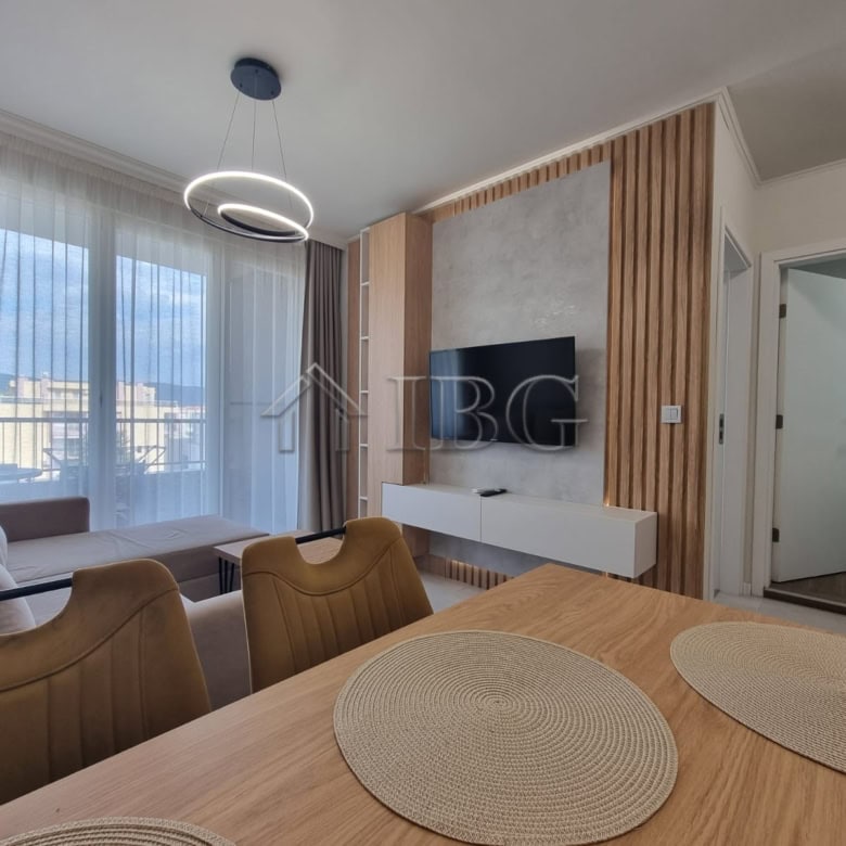 Bright 1-bedroom apartment with living area, modern decor, and balcony in Sunny Beach.