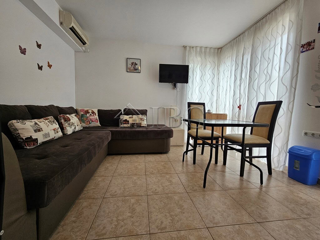 Apartment with pool view in Sveti Vlas, Dinevi Resort, featuring a living area, dining table, and mo.