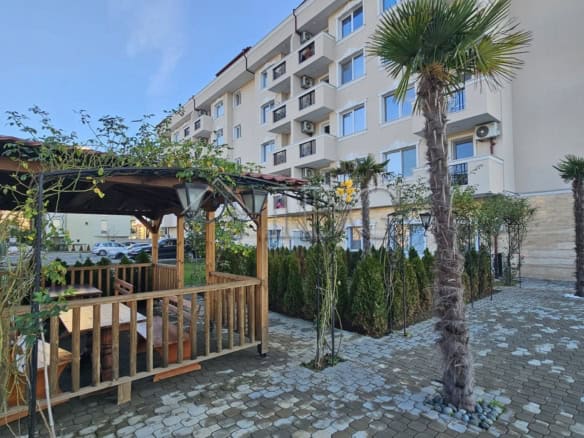 Bright apartment with outdoor terrace and lush greenery in Sunny Beach.