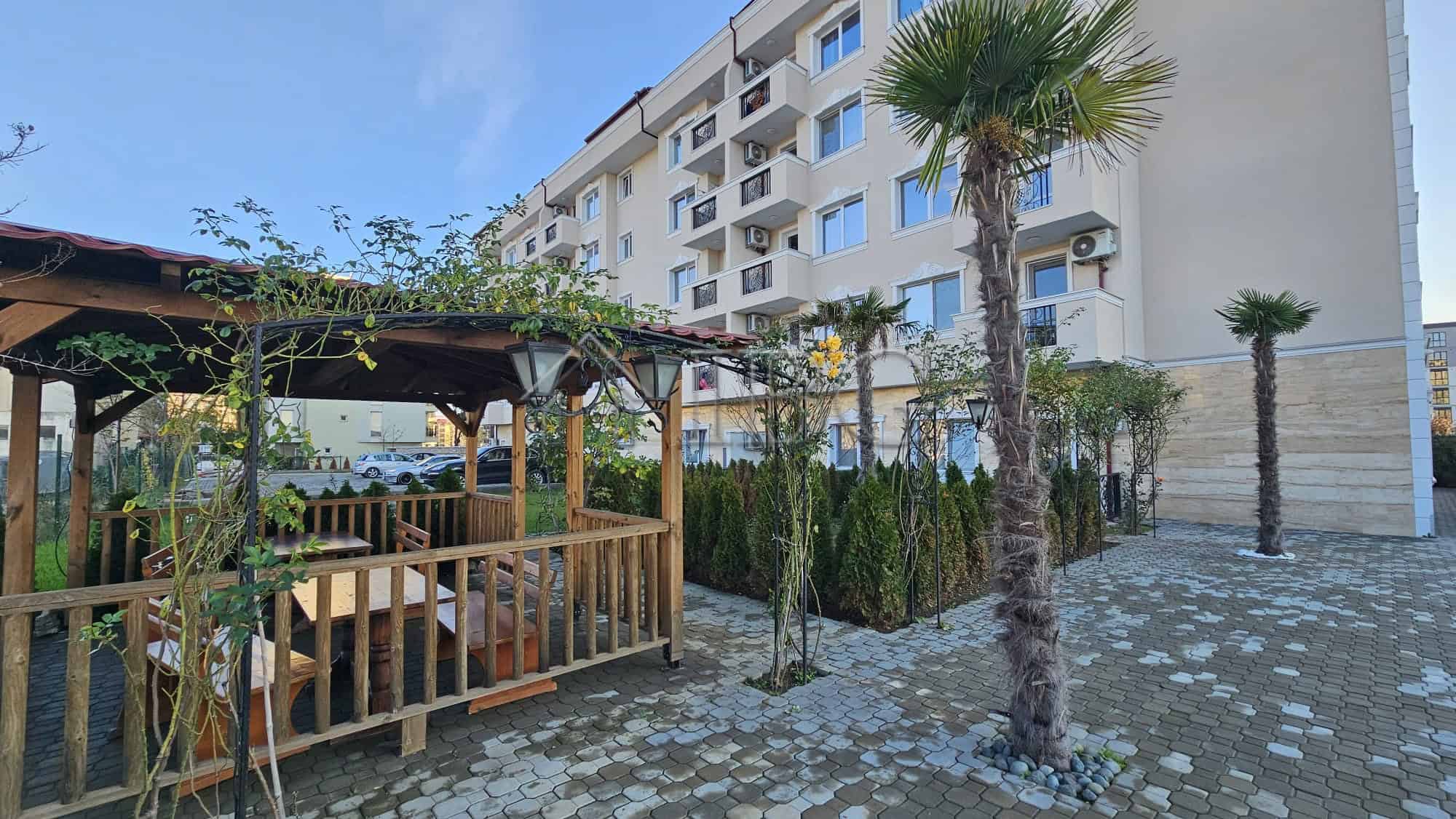 Bright apartment with outdoor terrace and lush greenery in Sunny Beach.