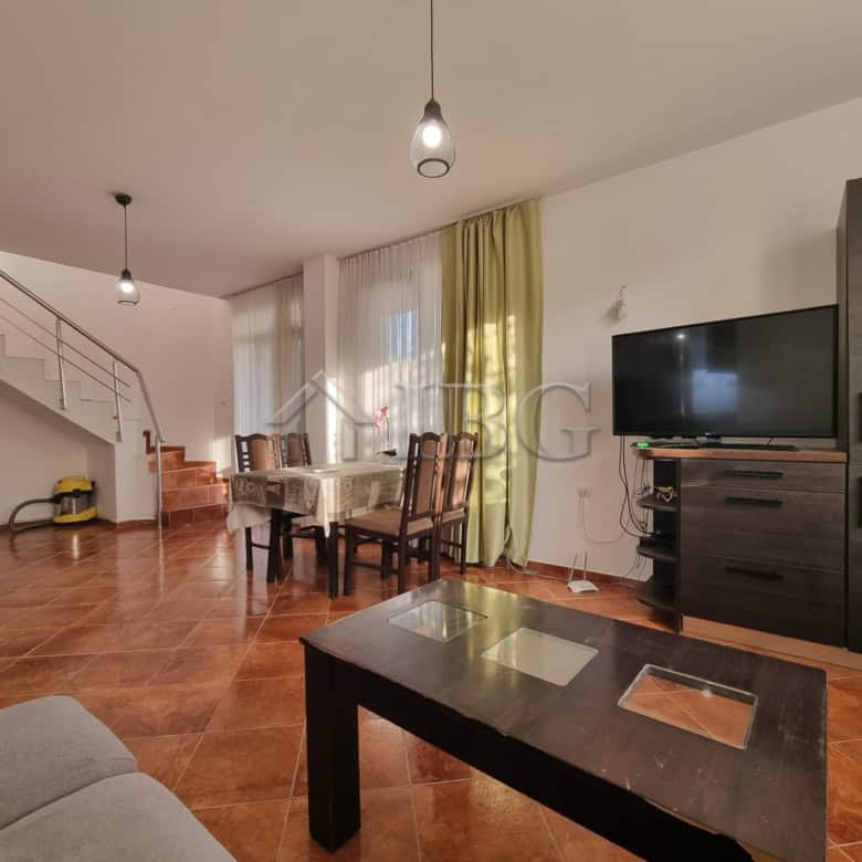 Spacious living room with modern furniture and large windows in Aleksandrovo, Burgas Region.