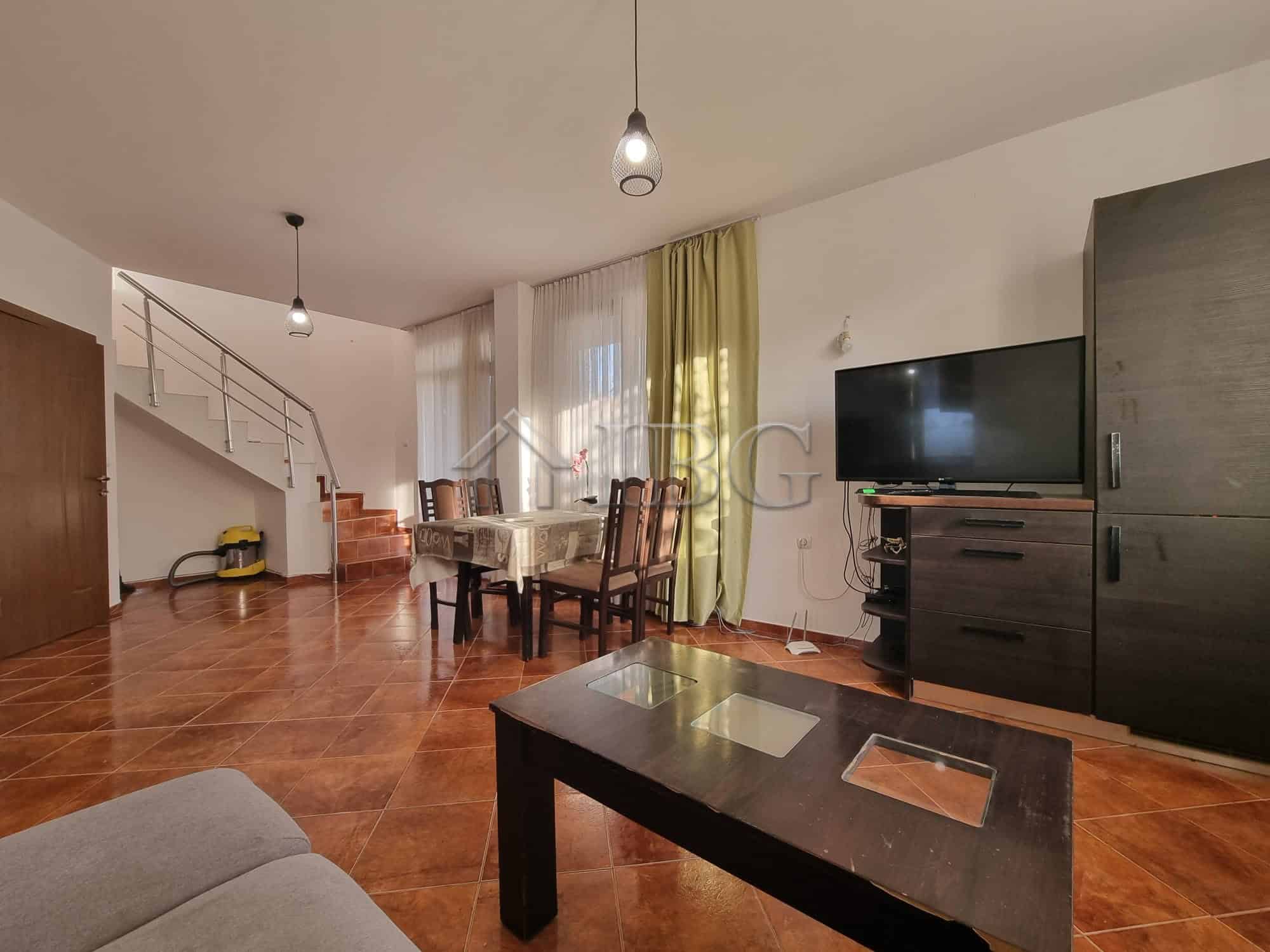Spacious living room with modern furniture and large windows in Aleksandrovo, Burgas Region.