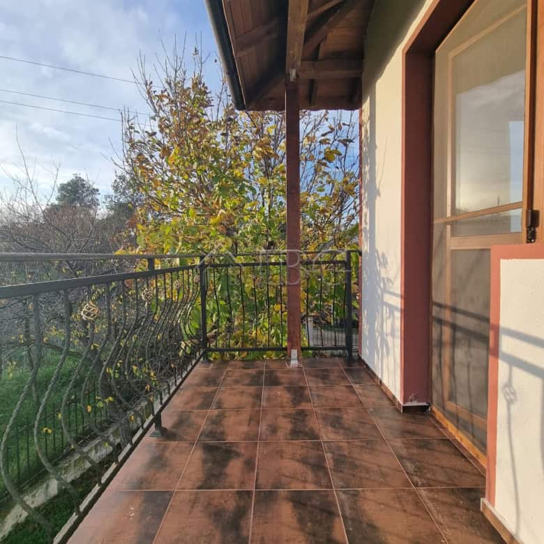 Balcony view from a two-story house in Aleksandrovo, Burgas Region, showcasing rustic charm and scen.