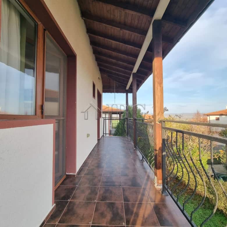 Balcony of a two-story house in Aleksandrovo, Burgas, offering scenic views and outdoor space.