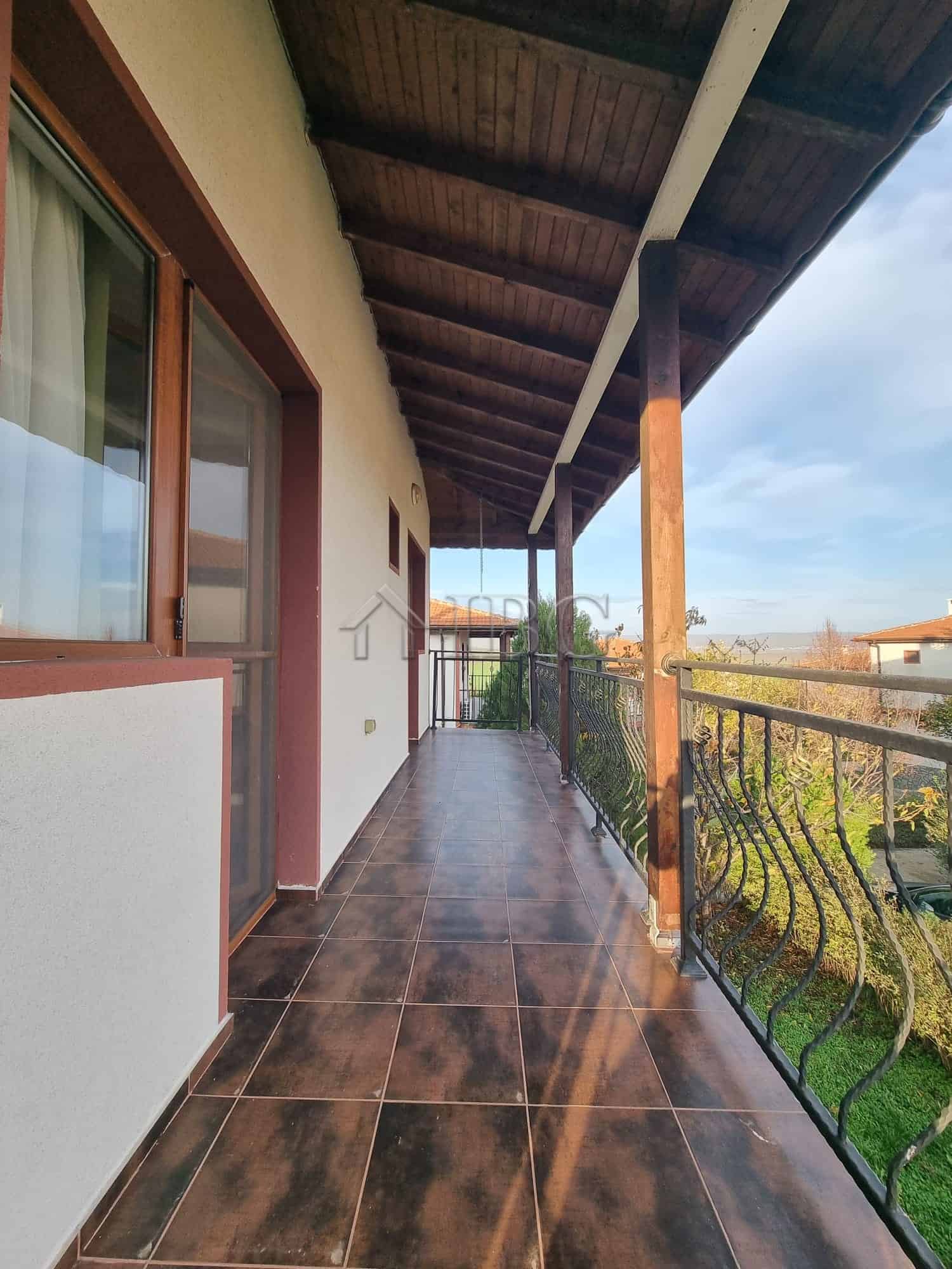 Balcony of a two-story house in Aleksandrovo, Burgas, offering scenic views and outdoor space.