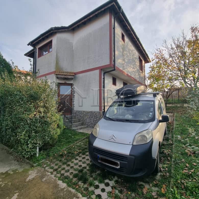 Two-story house in Aleksandrovo, Burgas region, Bulgaria, with a car parked outside.