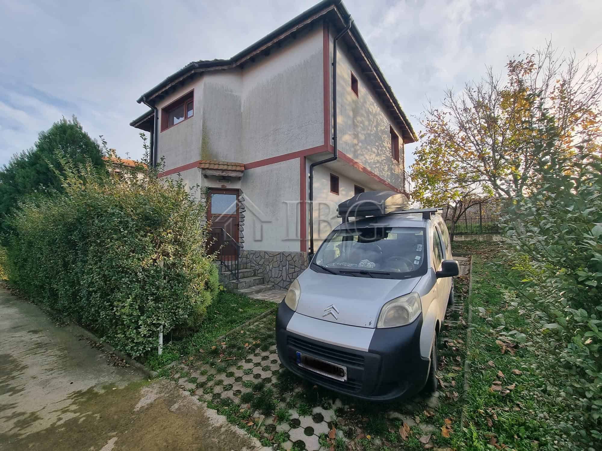 Two-story house in Aleksandrovo, Burgas region, Bulgaria, with a car parked outside.