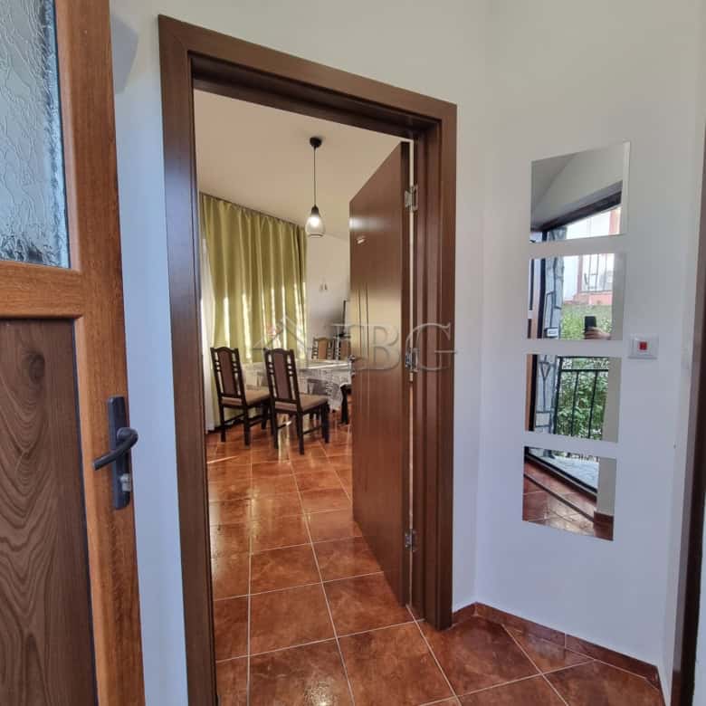 Bright entrance hall with wooden door and window in Aleksandrovo, Burgas Region.