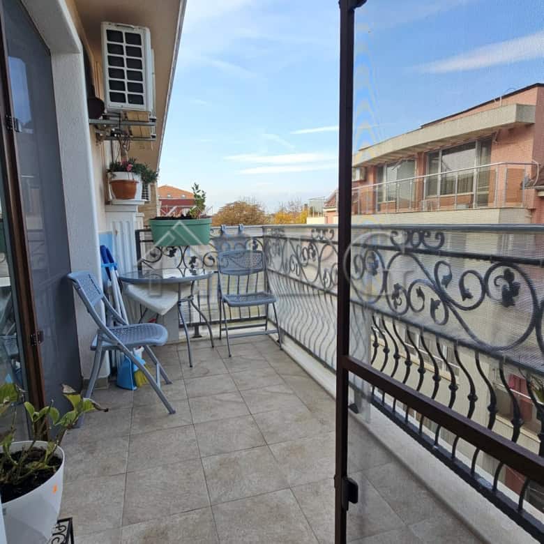 Balcony view of Nessebar with outdoor seating in a modern one-bedroom apartment.