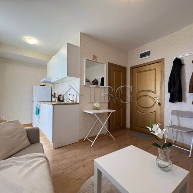Apartment interior with living area, kitchen, and entrance in Aphrodite Park, Sunny Beach.