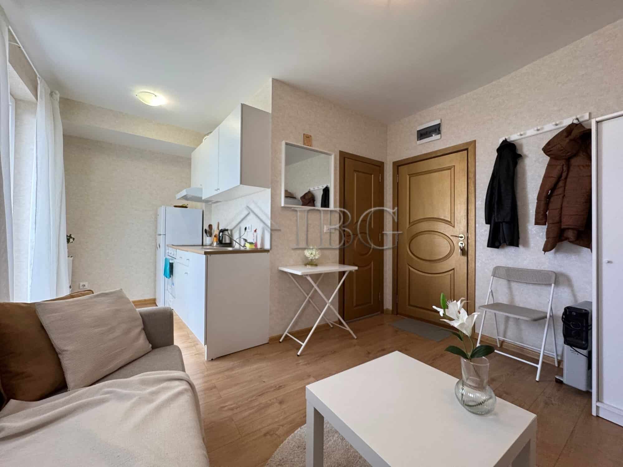 Apartment interior with living area, kitchen, and entrance in Aphrodite Park, Sunny Beach.