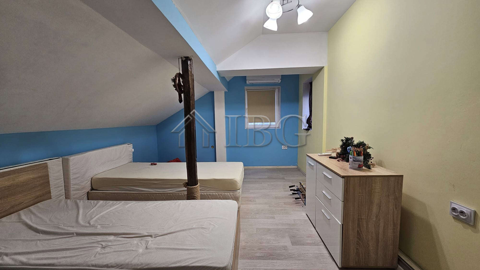 Bright interior of a 3-bedroom house with spacious yard, ideal for family living. Located near the s.