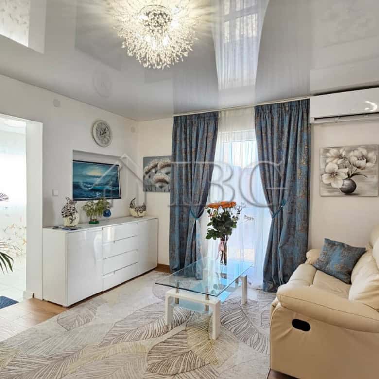Bright, modern living room with stylish decor and comfortable seating. Perfect for relaxing near Sun.