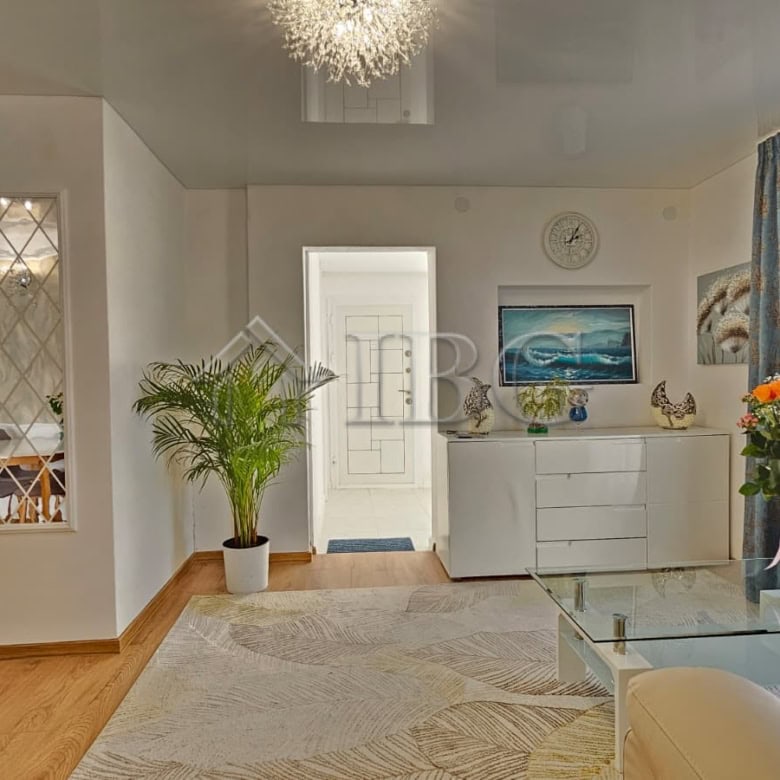 Bright and airy living room with modern decor and large windows in Kosharitsa near Sunny Beach.