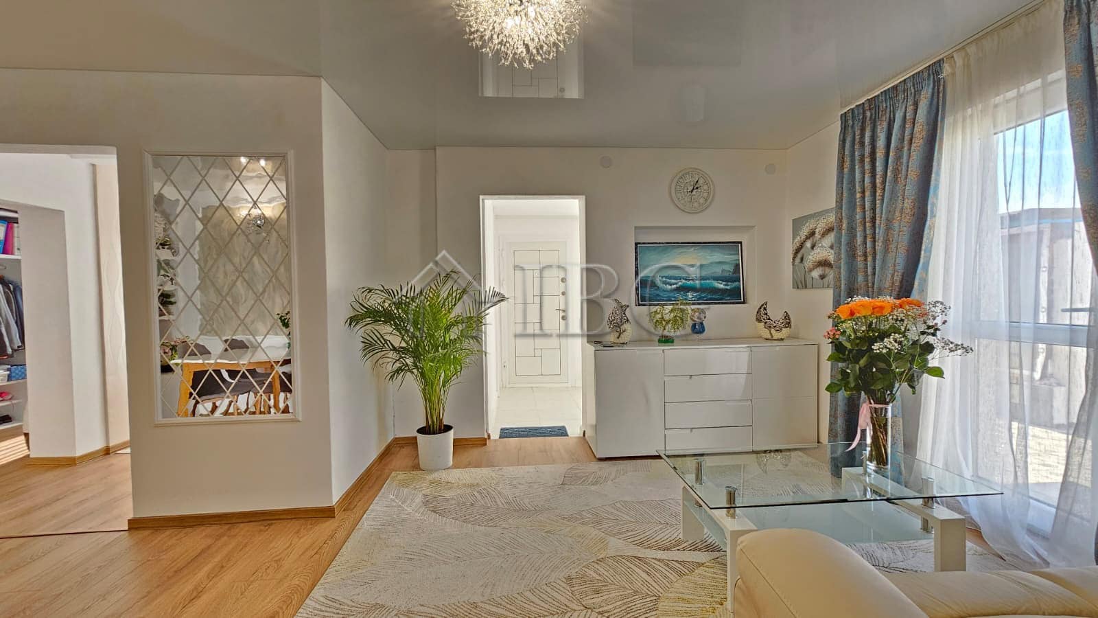 Bright and airy living room with modern decor and large windows in Kosharitsa near Sunny Beach.