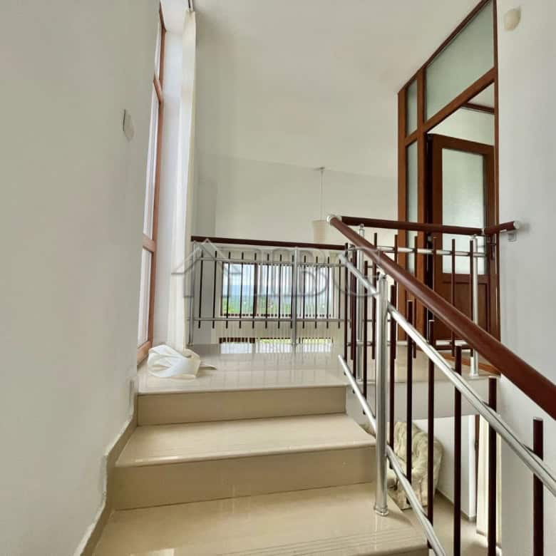 Spacious staircase leading to the upper floor of a house with 2 bedrooms and 2 bathrooms in Burgas r.