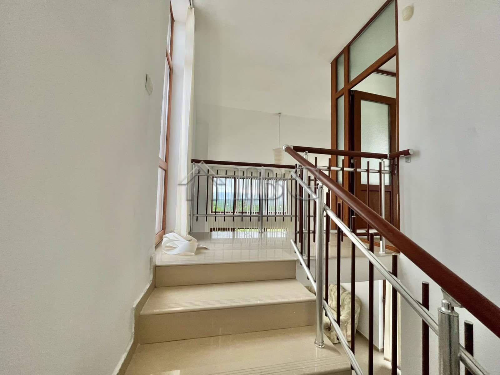 Spacious staircase leading to the upper floor of a house with 2 bedrooms and 2 bathrooms in Burgas r.