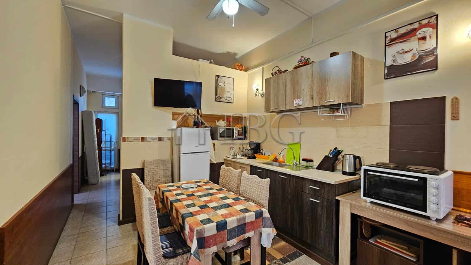Bright kitchen with dining area in Sunny Beach property.