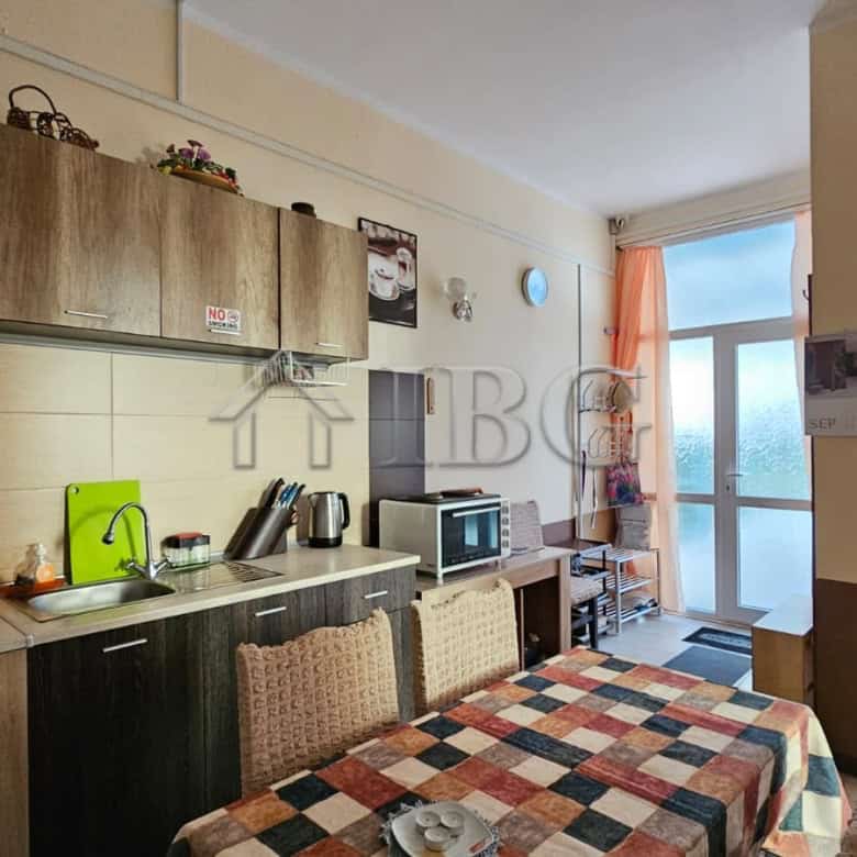 Bright apartment interior with balcony overlooking Sunny Beach in Old Junction Area.