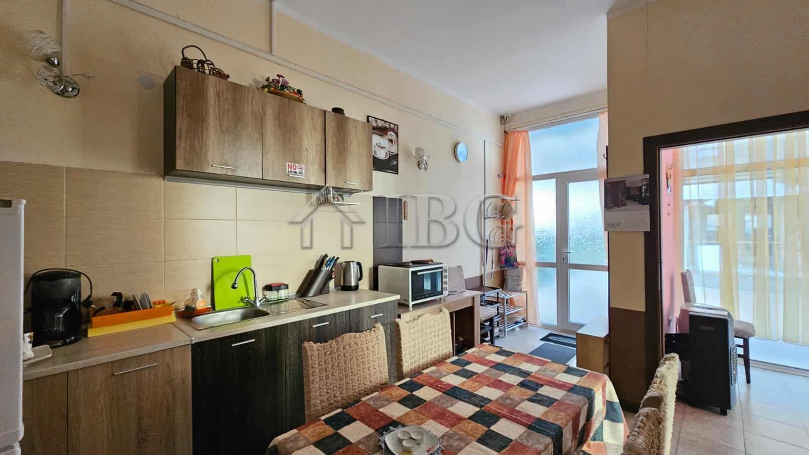 Bright apartment interior with balcony overlooking Sunny Beach in Old Junction Area.