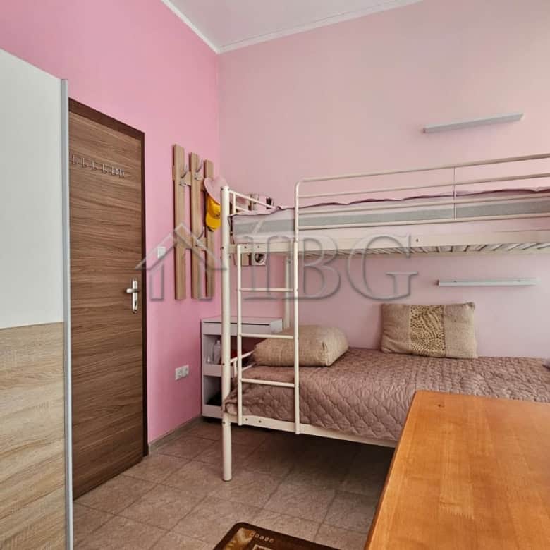 Modern bedroom with bunk beds in Sunny Beach apartment for sale in Old Junction area.