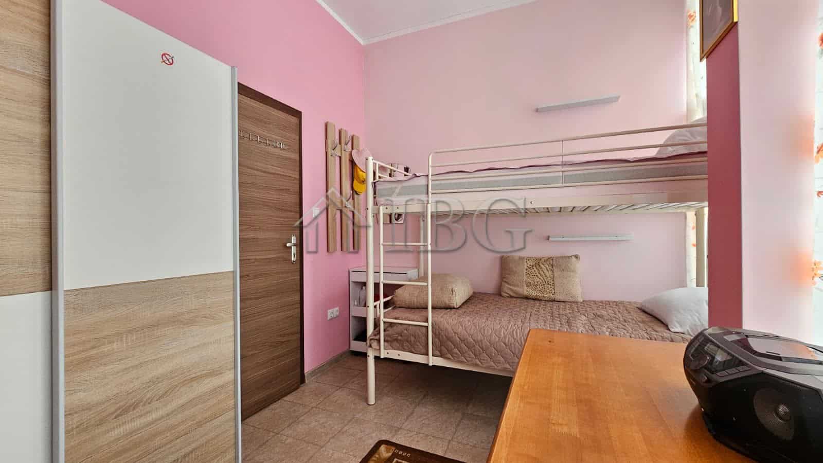 Modern bedroom with bunk beds in Sunny Beach apartment for sale in Old Junction area.