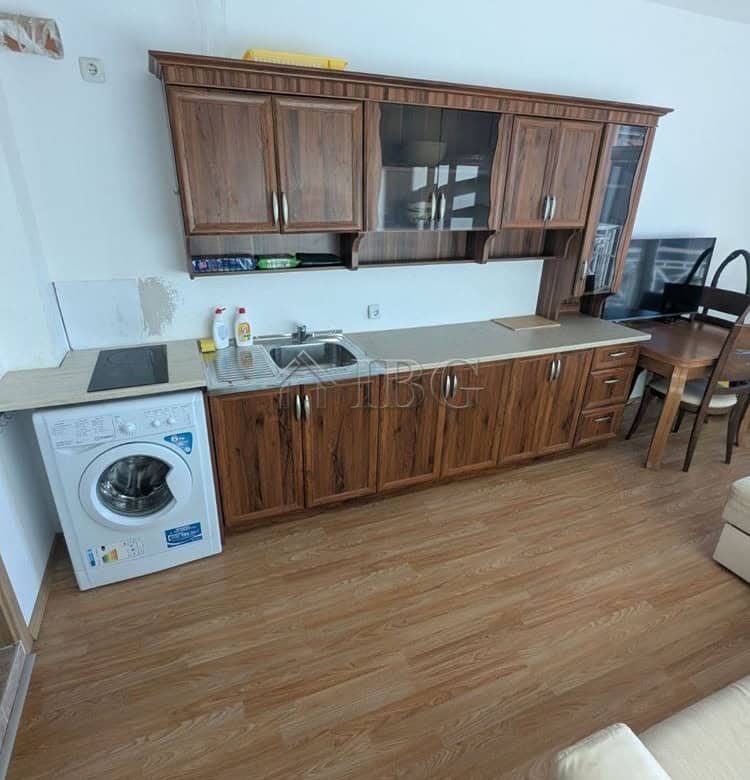 Furnished studio apartment with balcony in Sunny Beach, Bulgaria, featuring a compact kitchen and mo.
