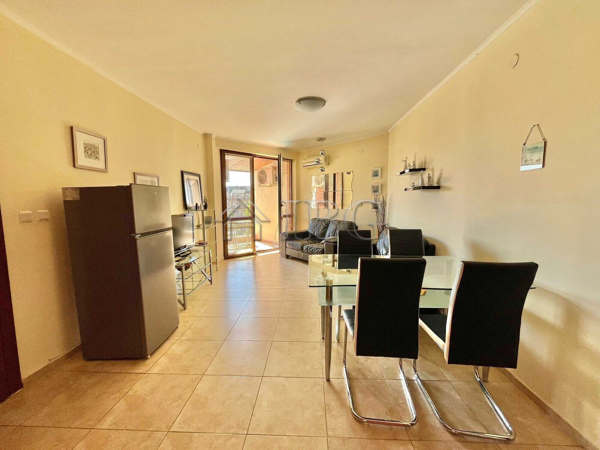 Bright living room with modern furniture and balcony views in Ravda.