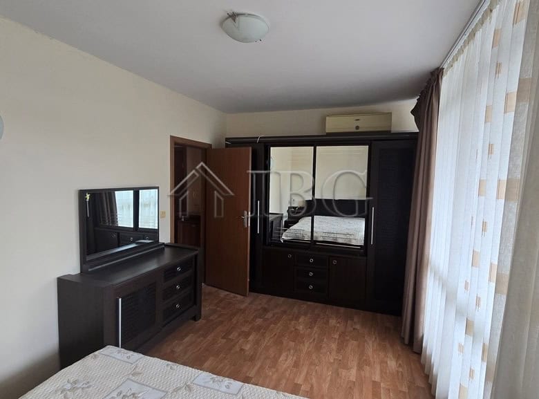 Interior of a spacious 2-bedroom apartment with a pool view in Sunny Beach.