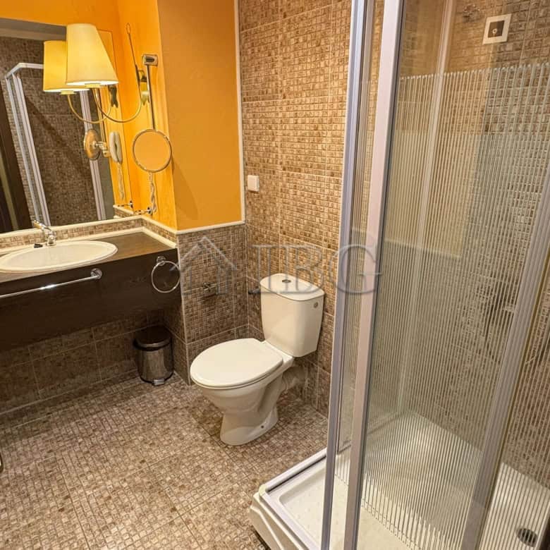 Modern bathroom with shower, toilet, and sink at Royal Beach Barceló, Sunny Beach.