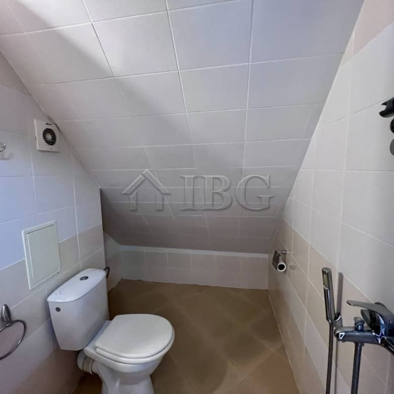 Bright bathroom in Dolce Vita 2 with modern fixtures and a sloped ceiling.