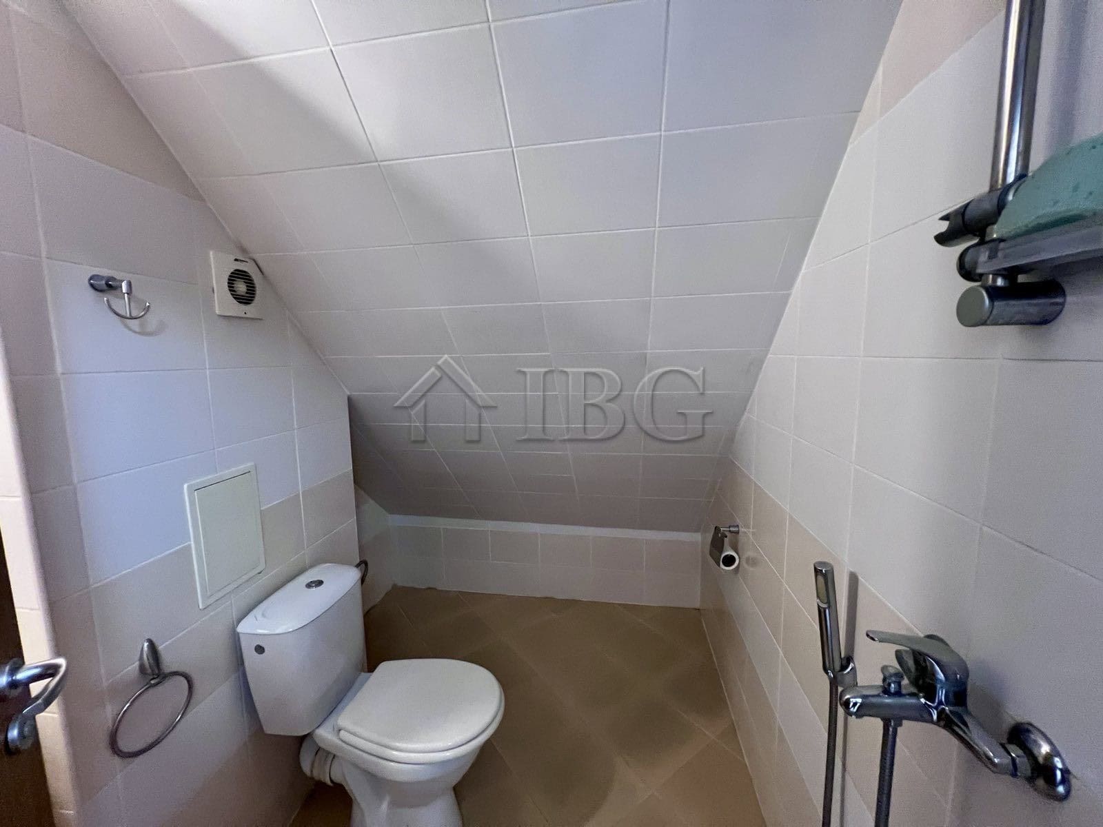 Bright bathroom in Dolce Vita 2 with modern fixtures and a sloped ceiling.