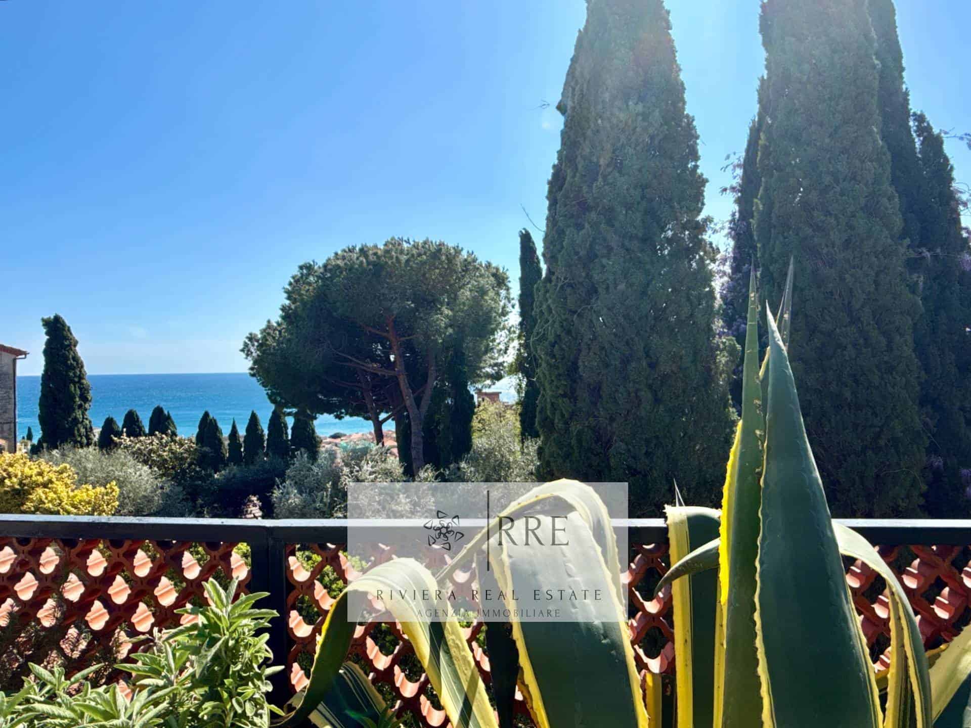 Luxury coastal property with sea view and lush greenery, perfect for a serene lifestyle.