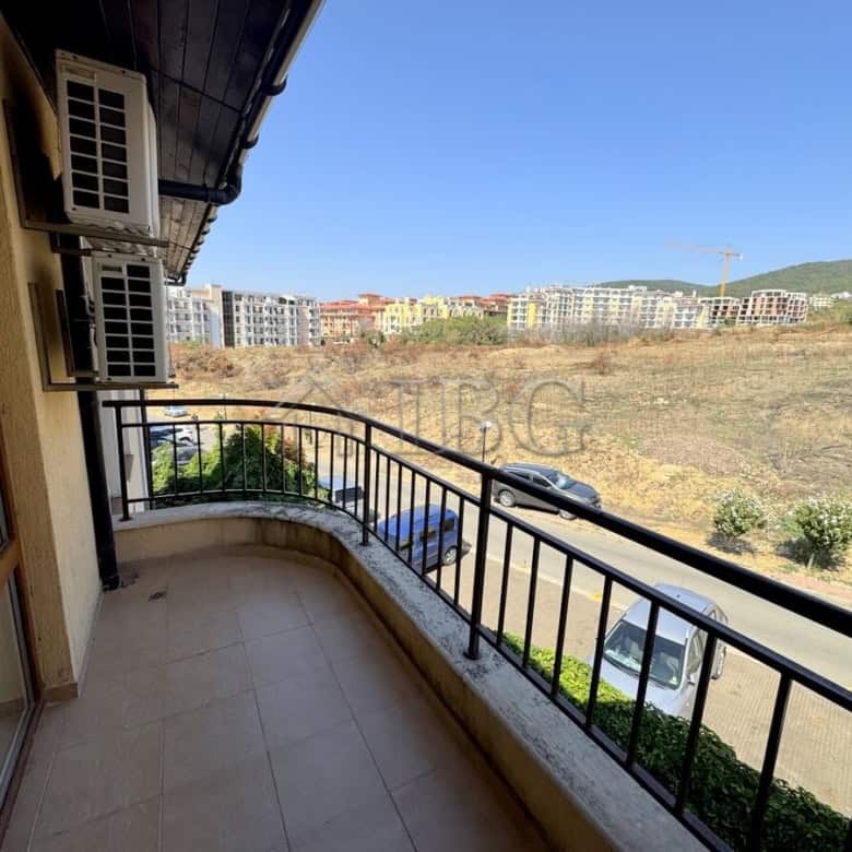 Balcony overlooking scenic mountains and residential area in Sveti Vlas, Bulgaria.