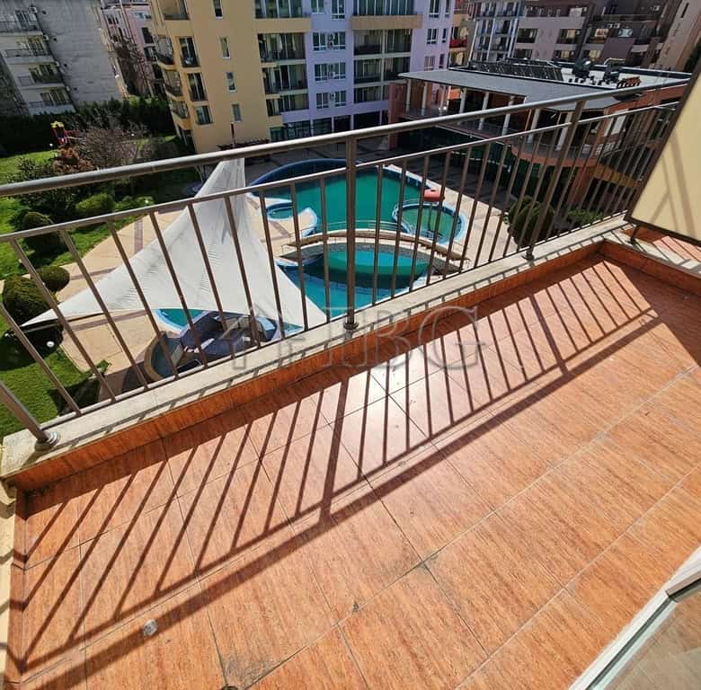 Balcony with pool view in a 42 sq. m. studio at Pollo Resort, Sunny Beach, perfect for relaxing.