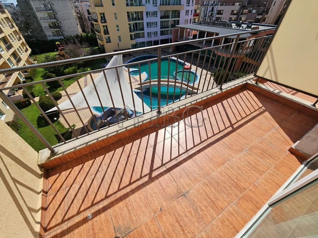 Balcony with pool view in a 42 sq. m. studio at Pollo Resort, Sunny Beach, perfect for relaxing.