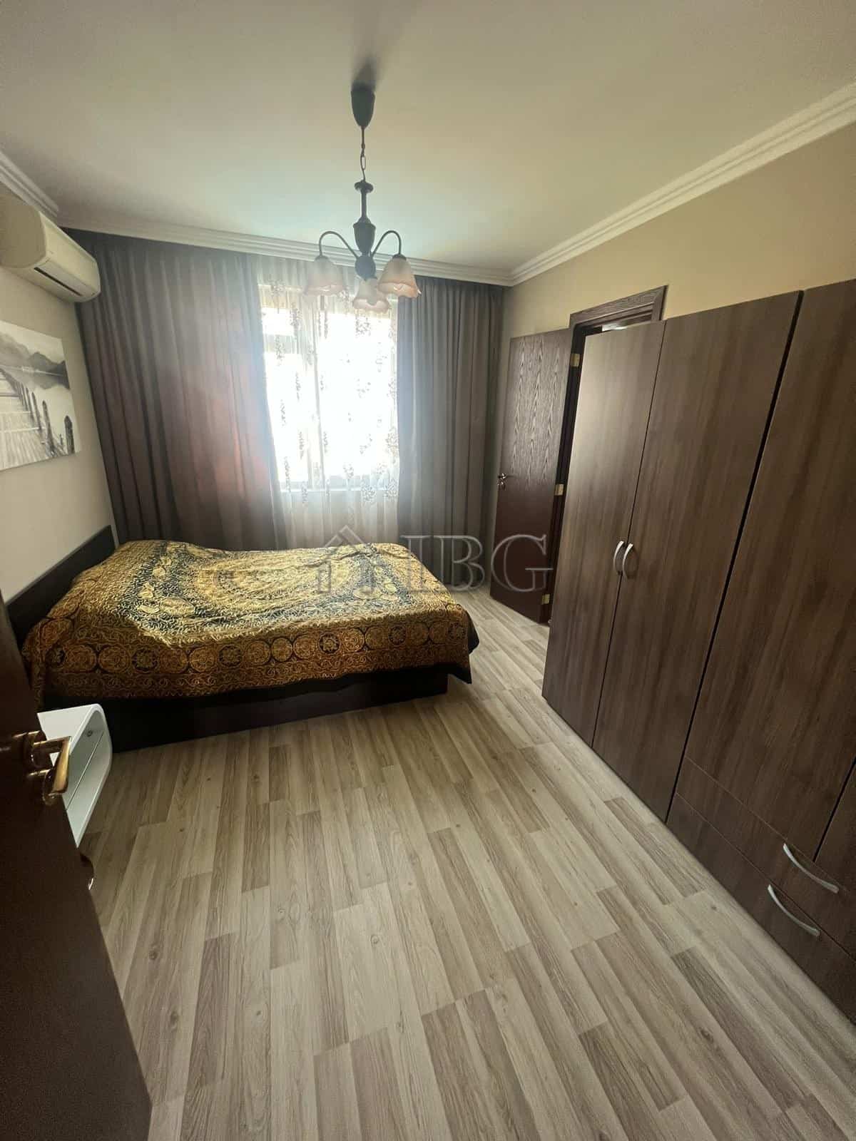Spacious bedroom with wardrobe and natural light in Sveti Vlas apartment.