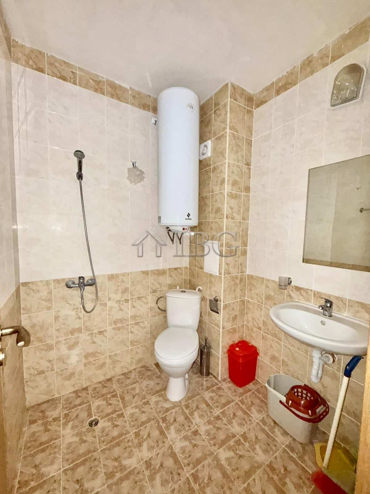 Furnished studio bathroom with toilet, sink, and water heater in Sunny Day 3, Sunny Beach.