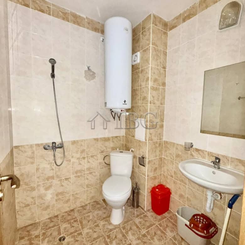 Furnished studio bathroom with toilet, sink, and water heater in Sunny Day 3, Sunny Beach.