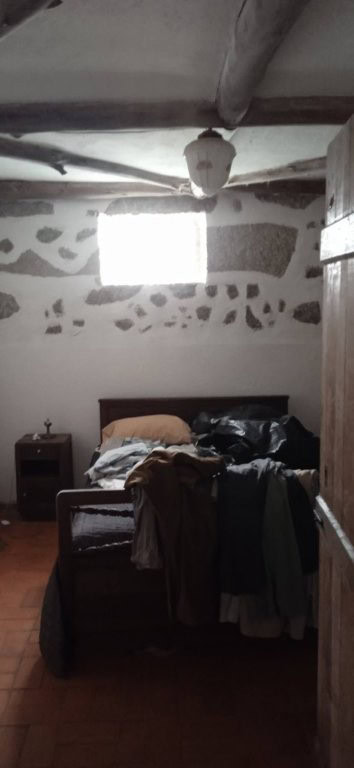 Interior of a rustic bedroom in a farm estate in Santa Comba Dao, Portugal.
